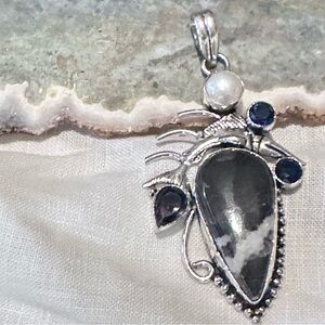Artisan hand crafted pendant featuring a BUFFALO TURQUOISE AND Amethyst accents